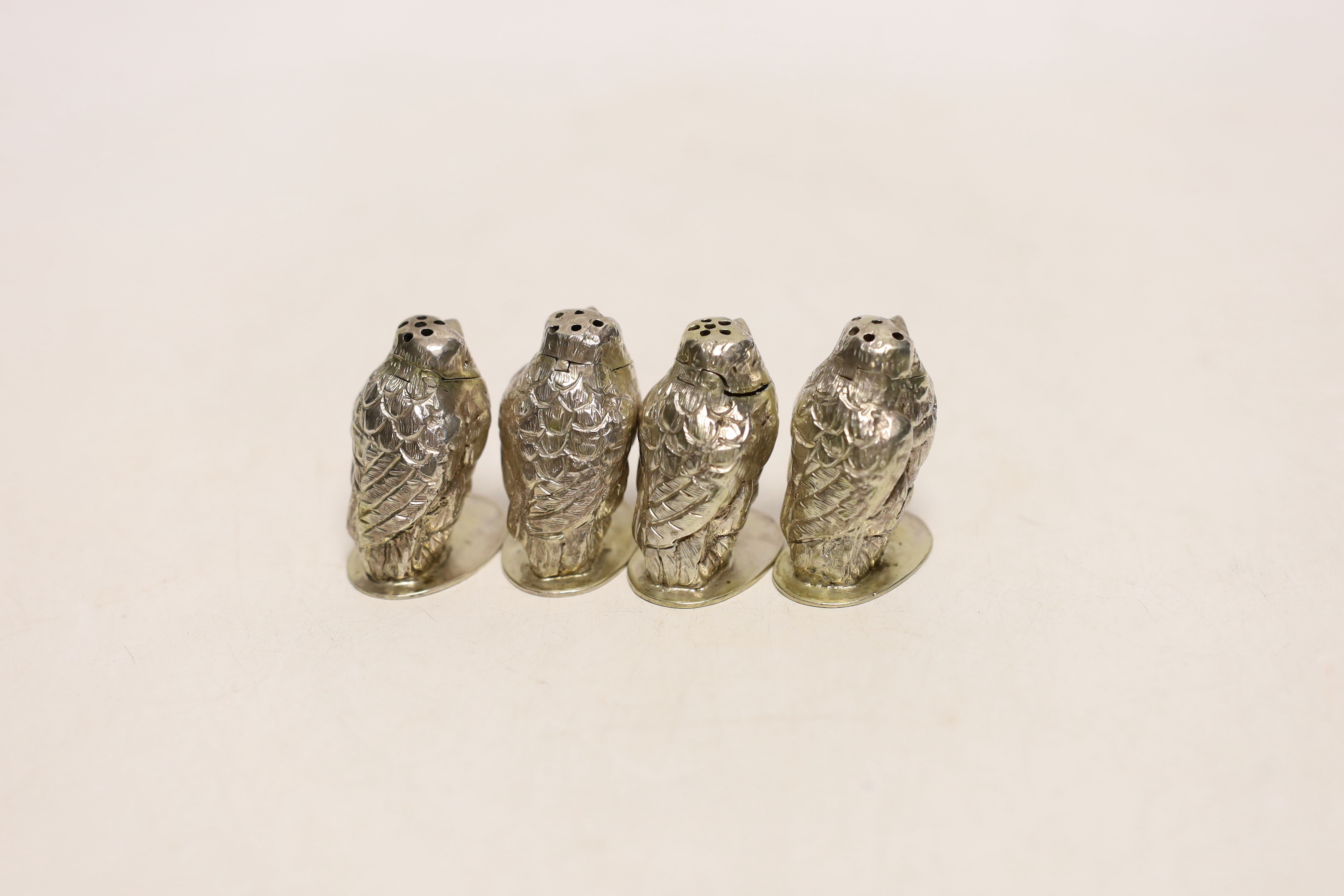 A set of four Italian 800 standard white metal bird pepperettes, by Fratelli Coppini, height 33mm.